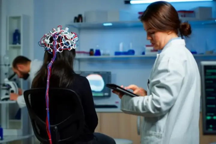 Clinical research professional conducting a neurological assessment